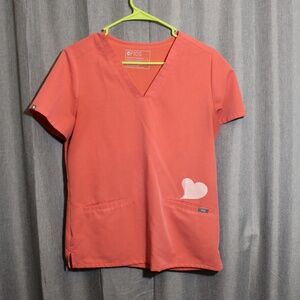 Peach figs scrub top with white glittery heart.